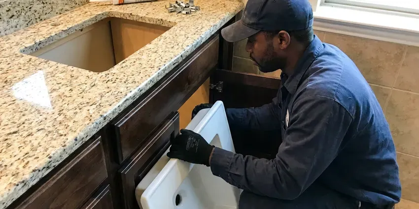 Beau's Plumbing technician providing faucet installation in Kenner